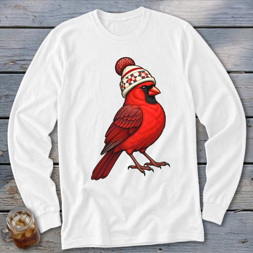 White long-sleeve shirt featuring an illustration of a red cardinal wearing a winter hat.