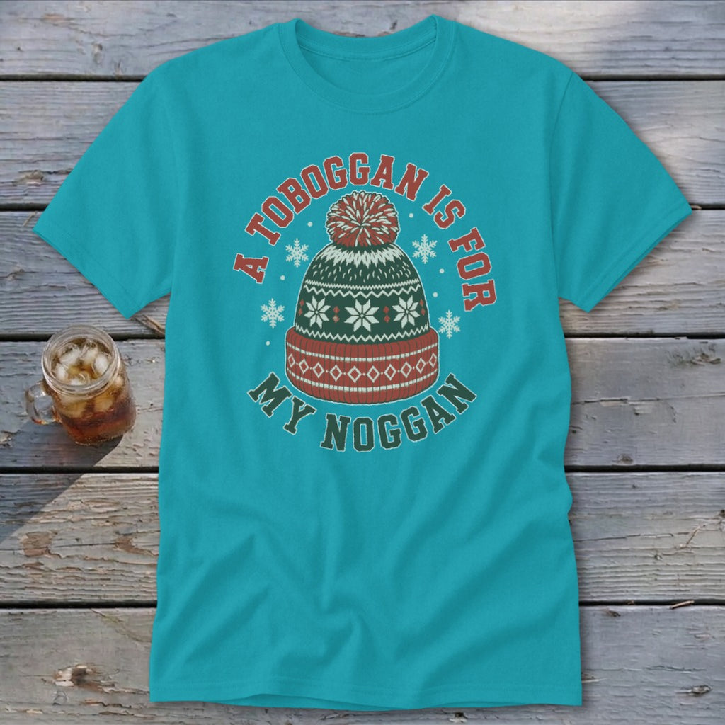 A teal t-shirt featuring a graphic of a winter hat with text reading A toboggan is for my noggan.