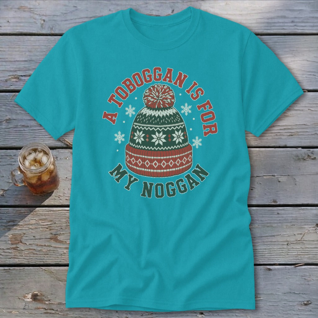 A teal t-shirt featuring a graphic of a winter hat with text reading A toboggan is for my noggan.