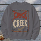 Gray sweatshirt with distressed "CRICK CREEK" sign graphic and checkmark.