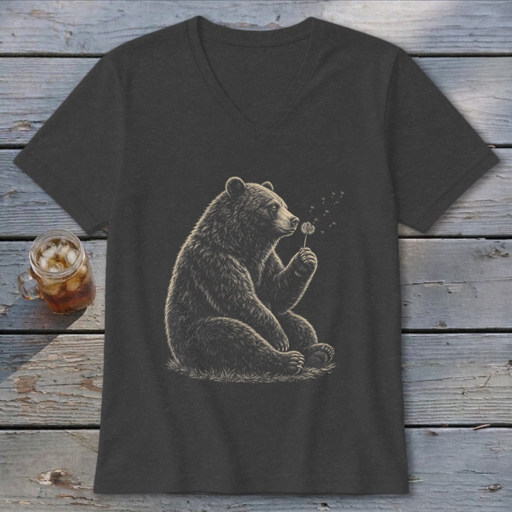 Bear sitting and blowing on a dandelion on a dark grey t-shirt.