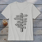 Light gray V-neck t-shirt featuring a black graphic of a wooden signpost with humorous distance directions.