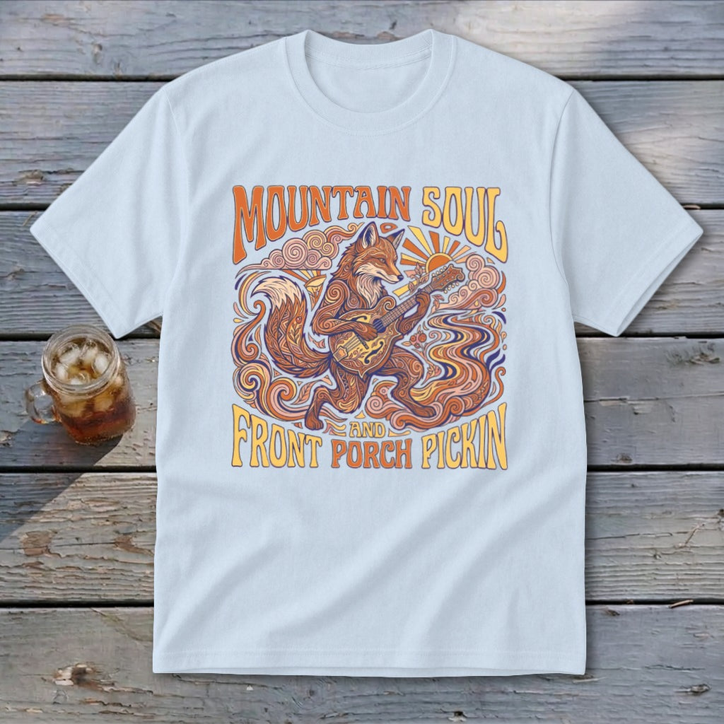 Light blue t-shirt with a fox playing guitar and text "Mountain Soul and Front Porch Pickin'".