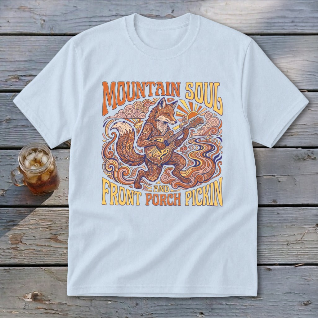 Light blue t-shirt with a fox playing guitar and text "Mountain Soul and Front Porch Pickin'".