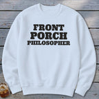 White sweatshirt with black text "FRONT PORCH PHILOSOPHER."