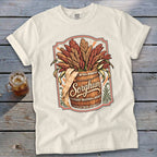 Cream t-shirt with "Sorghum" text on a barrel of grain illustration.
