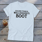 White t-shirt with black text reading "COLDER THAN A WELLDIGGER'S BOOT".