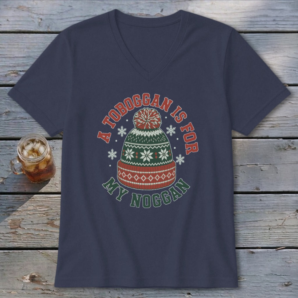 A dark blue V-neck t-shirt with a graphic of a winter hat and the text "A toboggan is for my noggan".