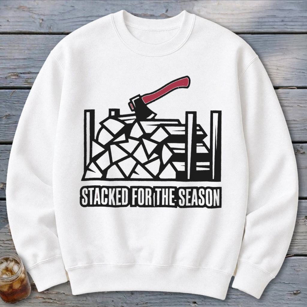 White sweatshirt with stacked firewood and axe graphic and "Stacked for the Season" text.
