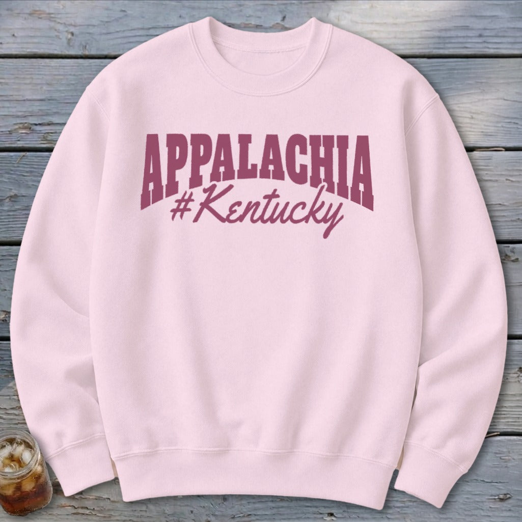 Pink crewneck sweatshirt with "Appalachia #Kentucky" text in maroon.