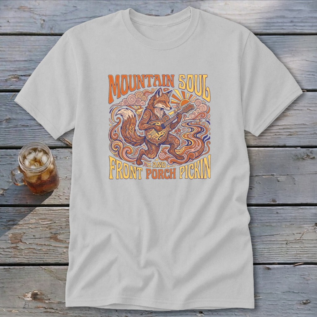 Light gray t-shirt with a graphic of a fox playing a banjo, text "Mountain Soul" and "Front Porch Pickin'".