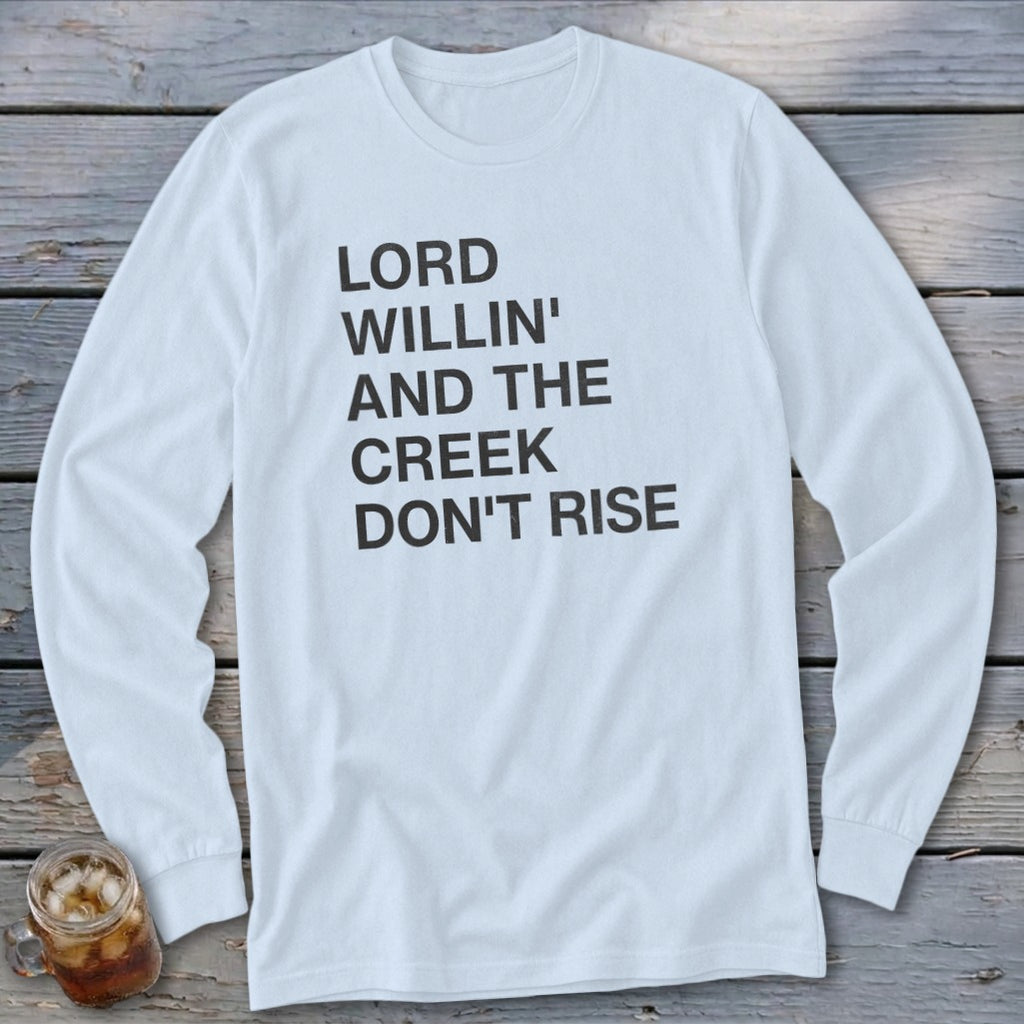 White long-sleeved shirt with black text: "Lord Willin' and the Creek Don't Rise."