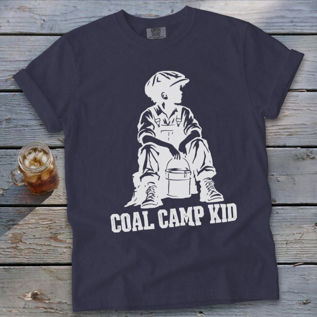 Navy t-shirt with white graphic of a boy in overalls and cap holding a bucket, text reads "COAL CAMP KID".