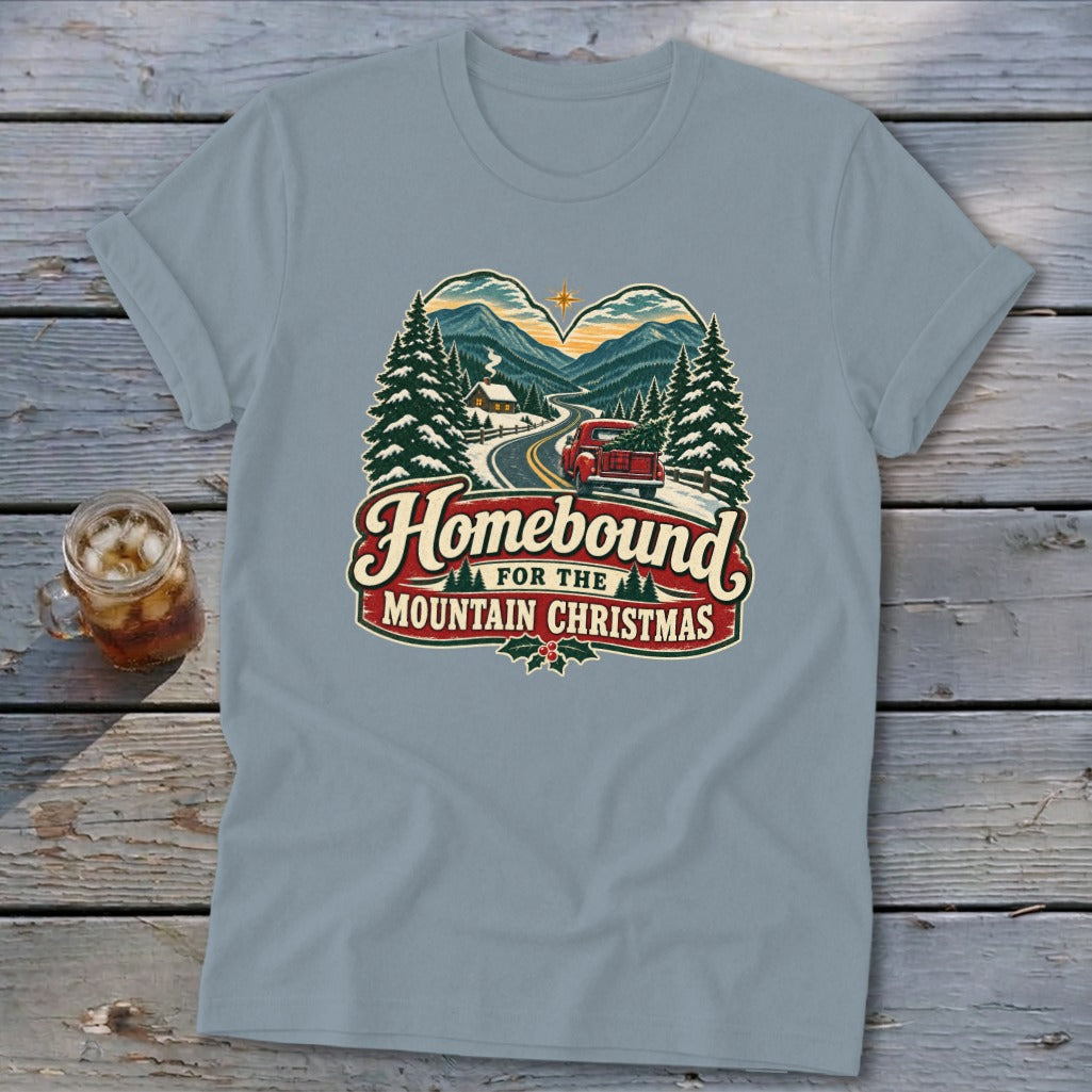 T-shirt with "Homebound for the Mountain Christmas" graphic featuring a red truck and snowy mountains.