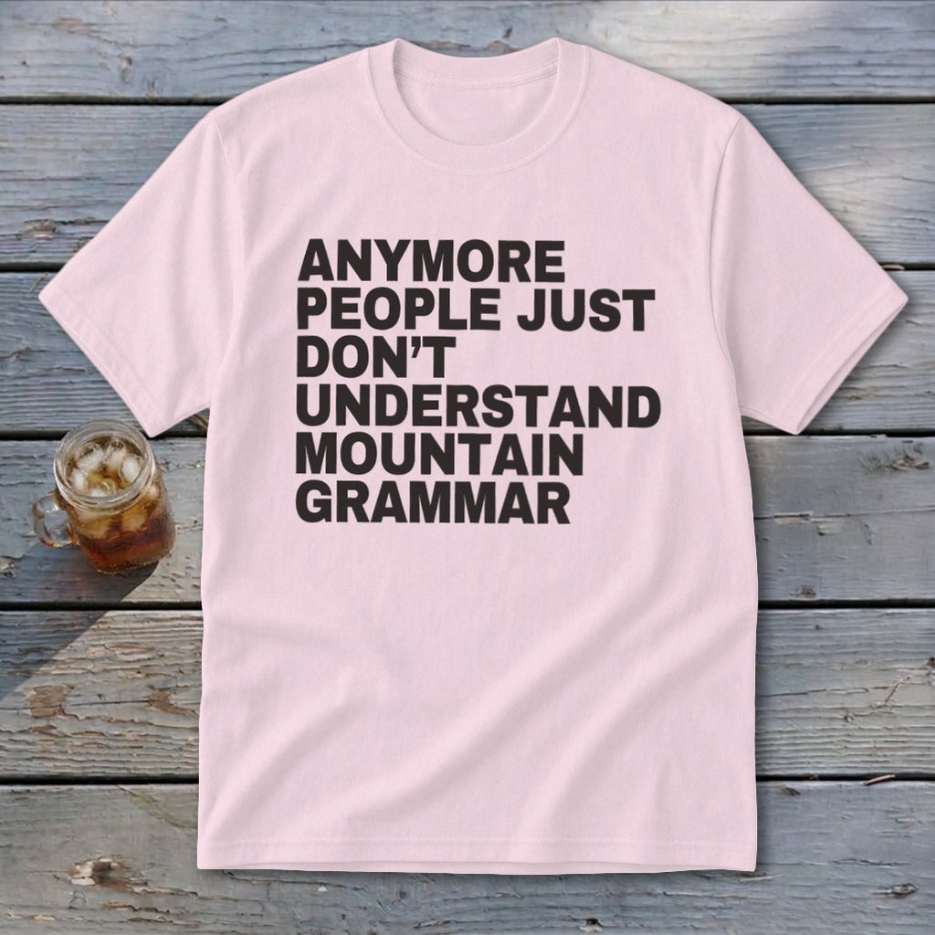 Pink t-shirt with black text that reads "anymore people just don't understand mountain grammar".