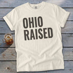 Cream t-shirt with "Ohio Raised" text in dark grey.