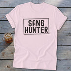 Pink t-shirt with black "SANG HUNTER" text in a rectangle.