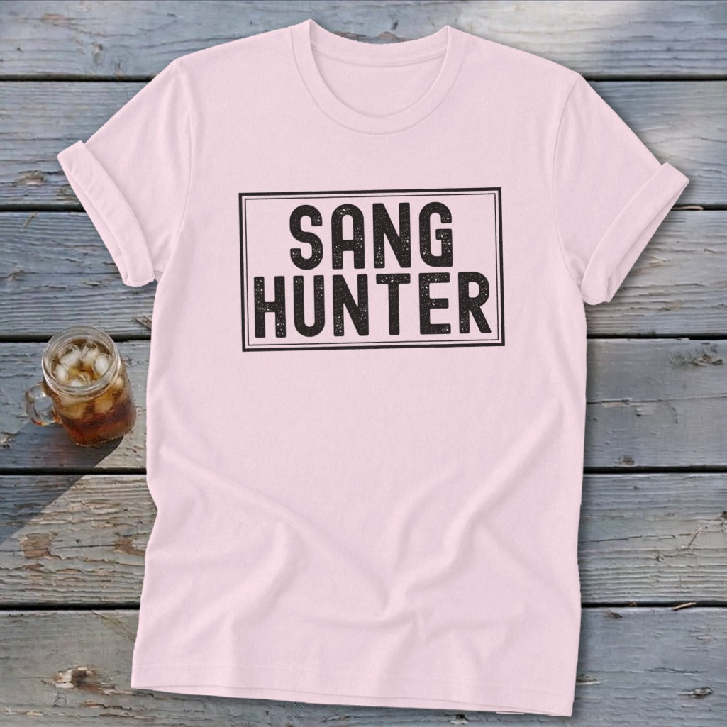 Pink t-shirt with black "SANG HUNTER" text in a rectangle.
