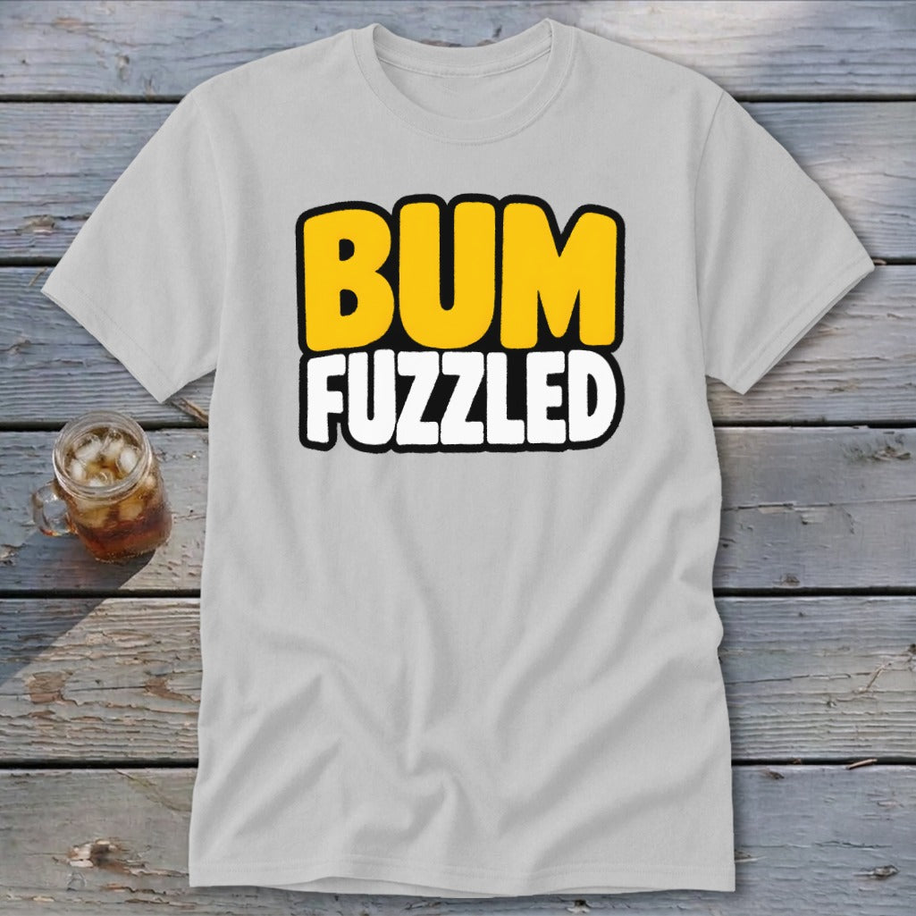 A light gray t-shirt with the words BUM FUZZLED printed in bold, yellow and white letters.