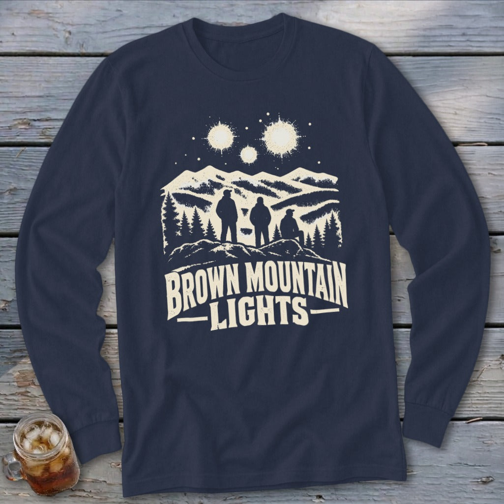 Navy blue long-sleeved t-shirt featuring a retro graphic of three figures, mountains, and the text Brown Mountain Lights.