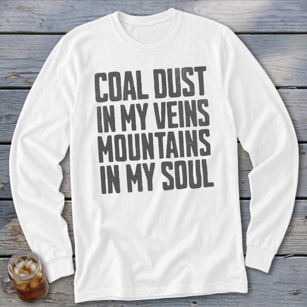 A white long-sleeved t-shirt with the gray text Coal Dust In My Veins Mountains In My Soul printed on the chest.