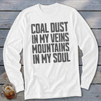 A white long-sleeved t-shirt with the gray text Coal Dust In My Veins Mountains In My Soul printed on the chest.