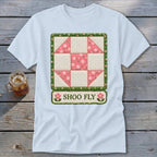 Light blue t-shirt with a Shoo Fly quilt block design and text.