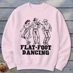 Black illustration of three people dancing with "FLAT-FOOT DANCING" text on a pink shirt.