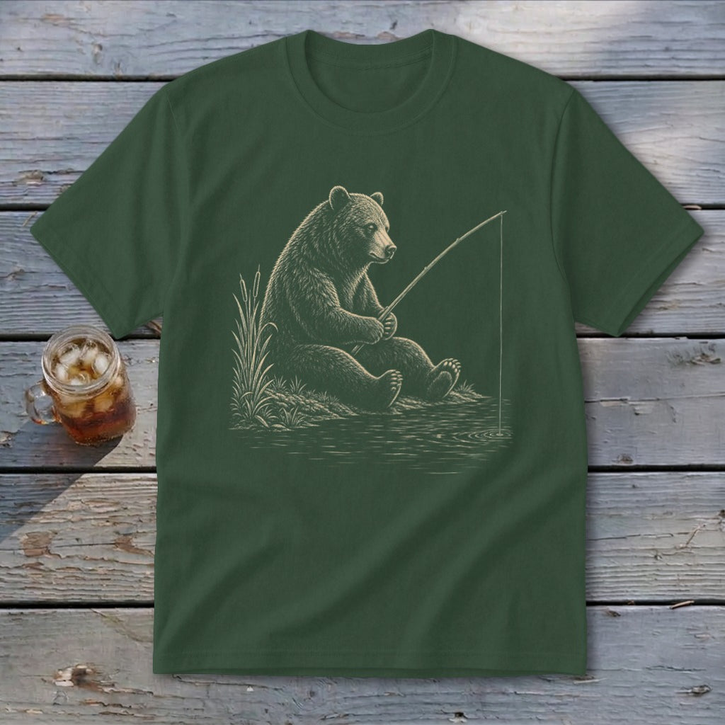Green t-shirt with an illustration of a bear fishing by a lake.