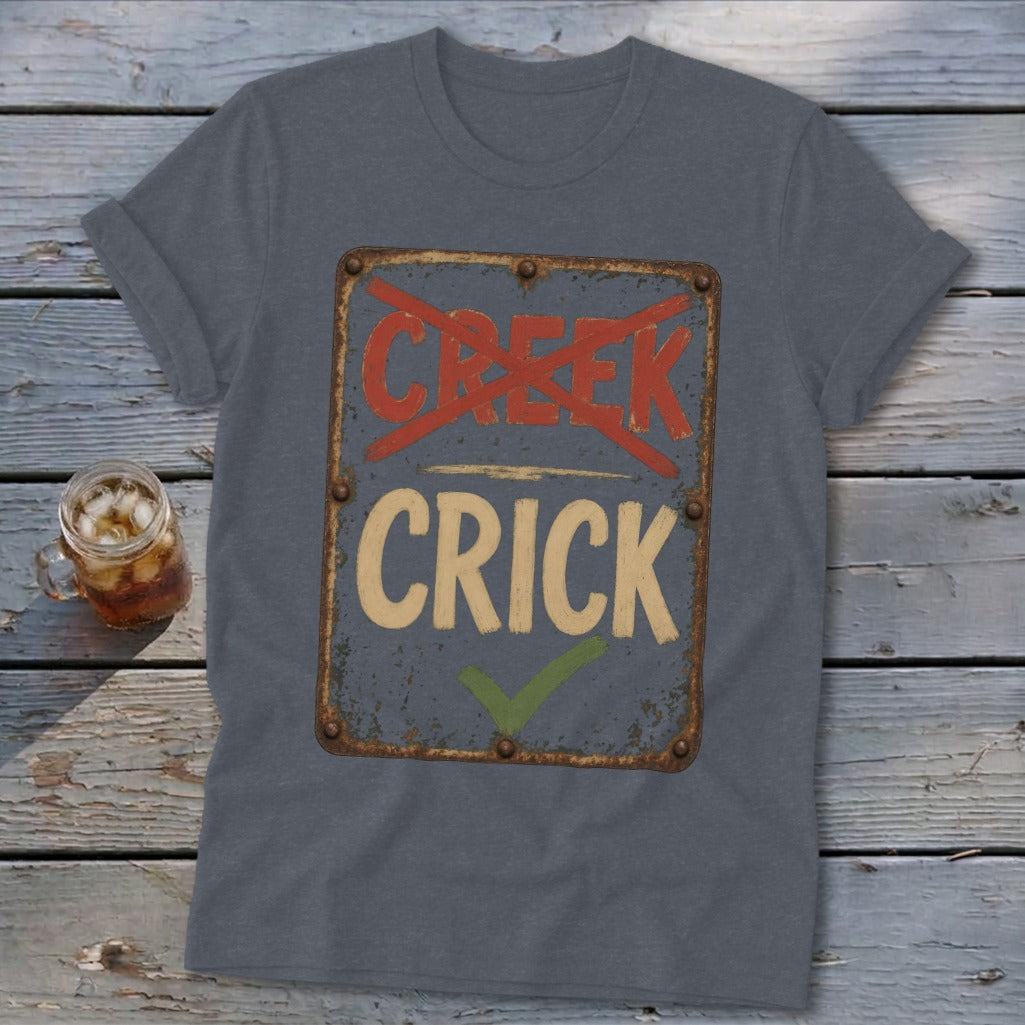T-shirt with weathered sign reading "CREEK" crossed out, "CRICK" checked off.