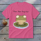 A pink t-shirt featuring a cartoon frog on a lily pad with the text finer than frog's hair.