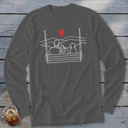 Line art of couple and dog on swing with heart and mountains above.
