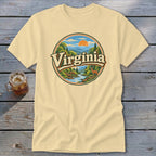 Cream t-shirt with circular Virginia mountain landscape graphic featuring a deer.