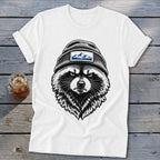 White t-shirt with illustration of a raccoon wearing a beanie with a mountain patch.