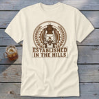 Cream t-shirt with brown lantern logo and text "Established in the Hills".