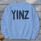 Light blue crewneck sweatshirt with "YINZ" in dark blue lettering.