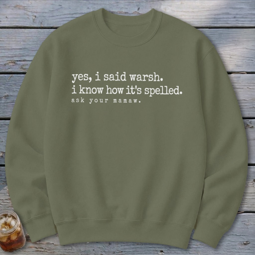 Olive green sweatshirt with white text: "yes, i said warsh. i know how it's spelled. ask your mamaw."