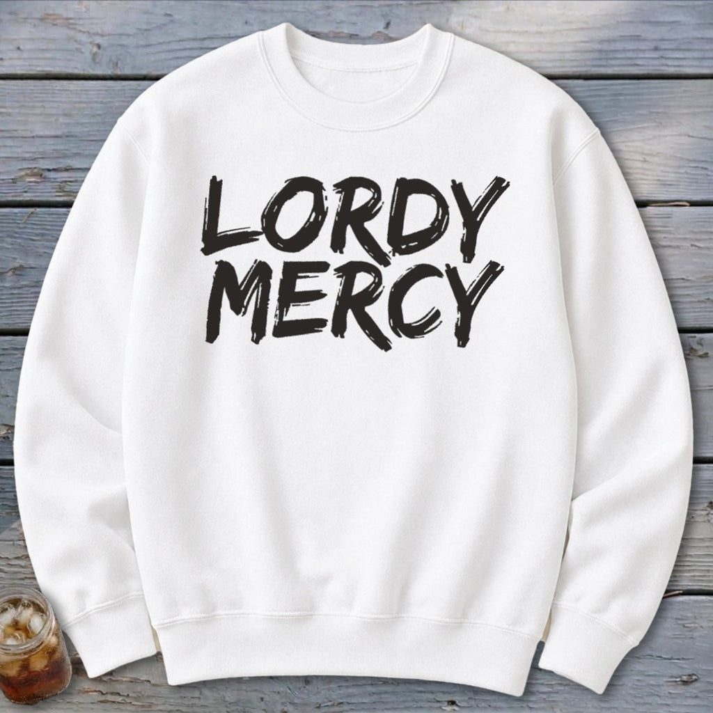 White sweatshirt with "LORDY MERCY" in bold black brushstroke text.