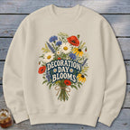 Cream sweatshirt with a floral graphic and text "Decoration Day Blooms".