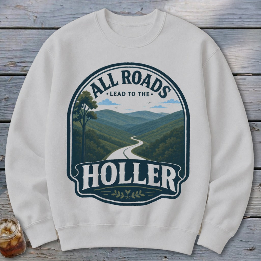 White sweatshirt with "ALL ROADS LEAD TO THE HOLER" landscape graphic.
