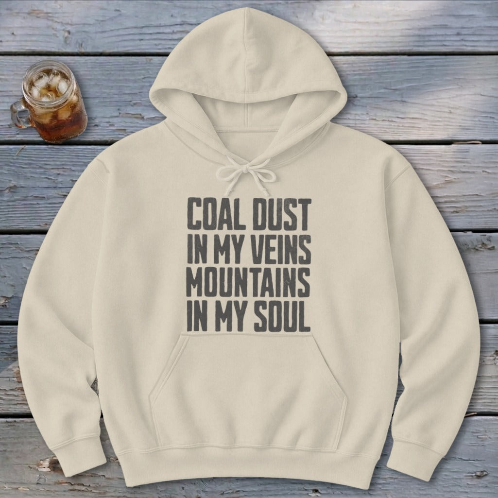 Cream-colored hoodie featuring the distressed text Coal Dust in My Veins Mountains in My Soul.