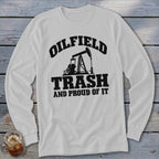 White long-sleeve shirt with black graphic text "OILFIELD TRASH AND PROUD OF IT" and pumpjack.
