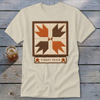 Cream t-shirt with a quilted "Turkey Track" design in brown and orange.
