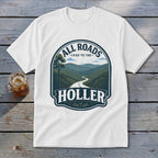 White t-shirt with a dark blue graphic of a winding road through green mountains and the text "ALL ROADS LEAD TO THE HOLLER".