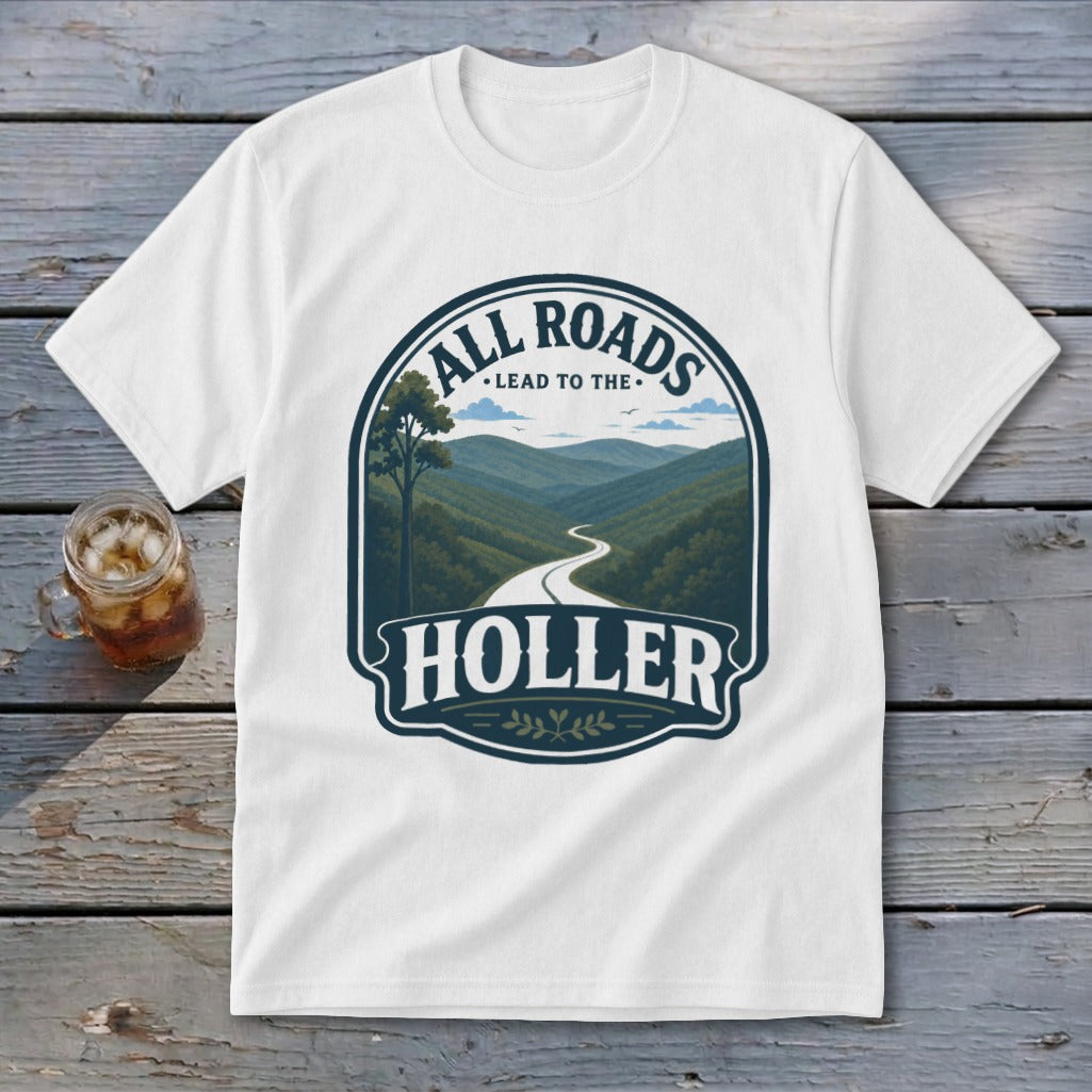 White t-shirt with a dark blue graphic of a winding road through green mountains and the text "ALL ROADS LEAD TO THE HOLLER".