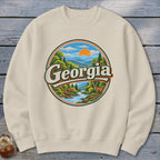 Cream sweatshirt with circular graphic of Georgia mountains, river, deer, and sunset.