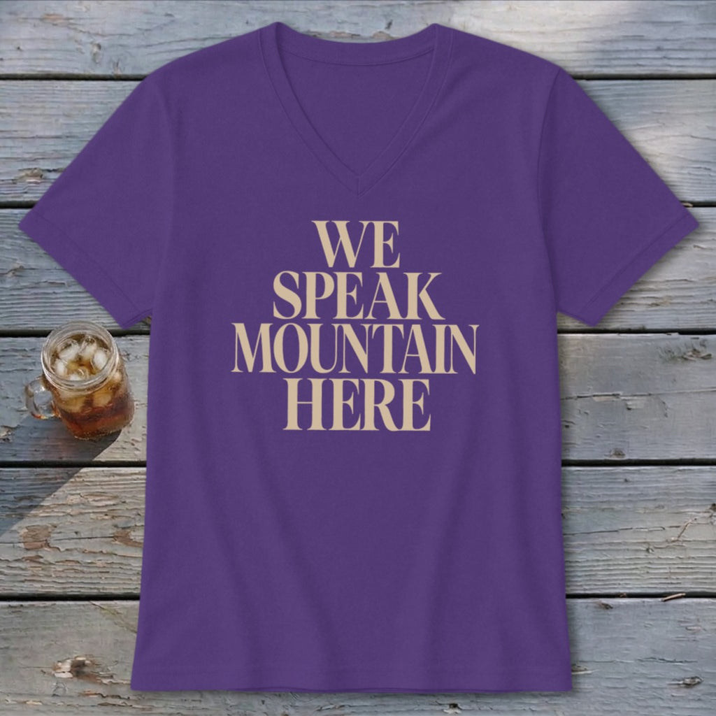 Purple v-neck t-shirt with "WE SPEAK MOUNTAIN HERE" text
