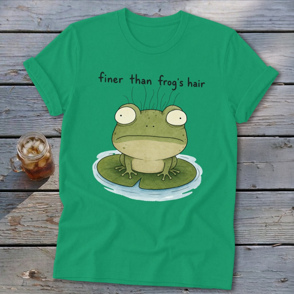 Green t-shirt featuring an illustration of a frog on a lily pad with the text finer than frog's hair.
