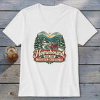 White v-neck t-shirt featuring "Homebound for the Mountain Christmas" with a vintage truck and snowy landscape design.