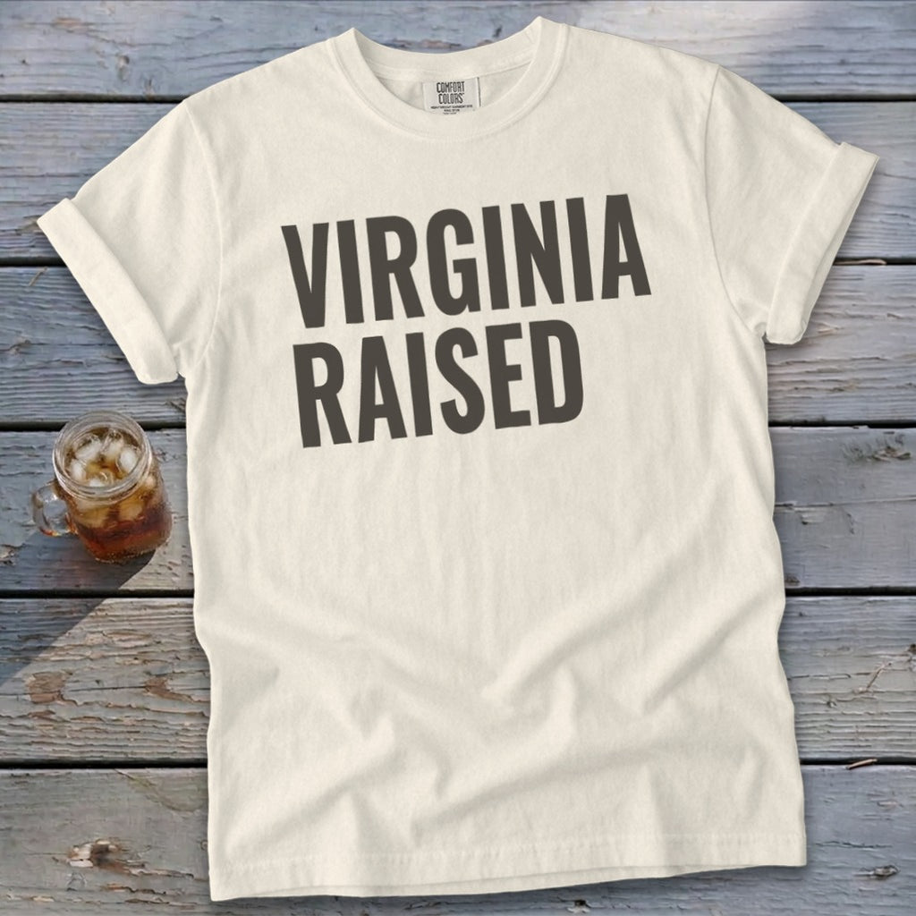 Cream t-shirt with "VIRGINIA RAISED" in dark grey bold text.